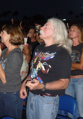 An air guitarist in the audience plays along with Lynyrd Skynyrd. (Photo by Thom Smith)