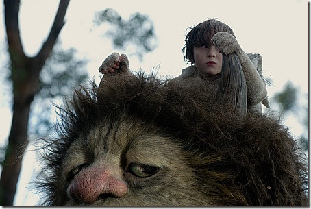 Max (Max Records) sits atop Carol (voice of James Gandolfini) in Where the Wild Things Are.