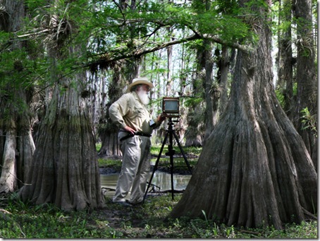 Clyde Butcher at work with a view camera in a Florida swamp. (Photo courtesy Jackie Butcher Obendorf) 