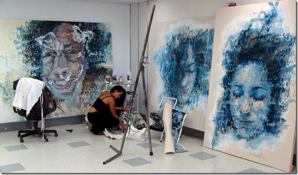 Painter Christina Major works on her large portrait paintings for the MFA exhibition at Florida Atlantic University. 