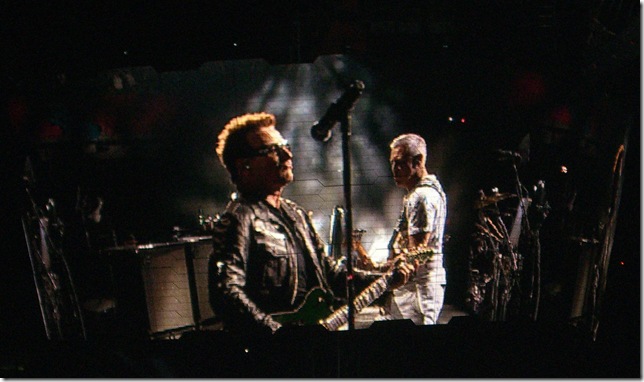 Bono and bassist Adam Clayton of U2, seen from the screen at Sun Life Stadium on Wednesday night. (Photo by Gretel Sarmiento)