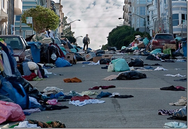 Jude Law surveys a trash-laden street in Contagion.