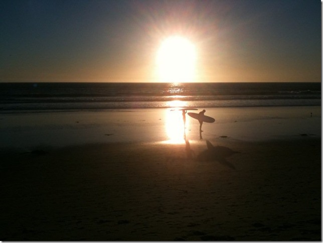 Surfers at sunset. (Photo by Marya Summers)