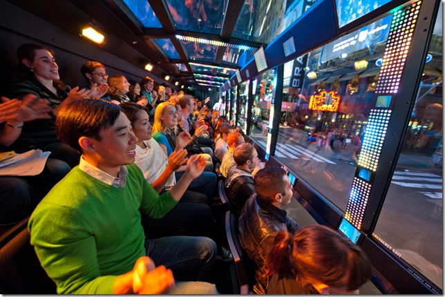 Patrons enjoy an insider’s view of the Big Apple aboard The Ride.