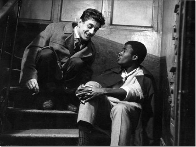 Angelo (a factory worker) and Landry (a student) converse in Chronicle of a Summer (1961).