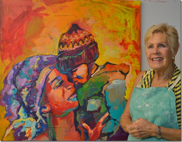 Ellen Levinson with one of her paintings.