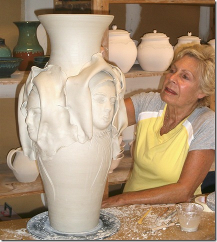 Ellen Levinson likes to add faces to her pots.