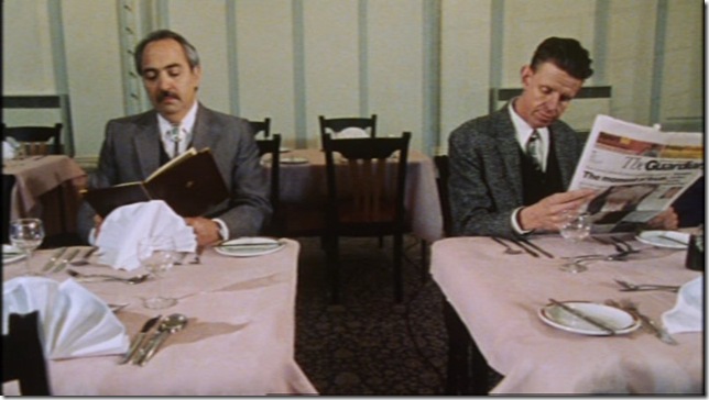 Miguel Sandoval and Alex Cox in Three Businessmen (1998).