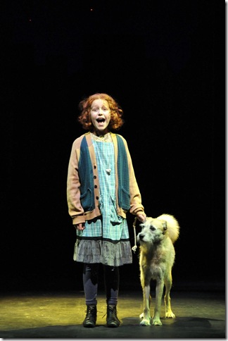 Clara Young (Annie) and Macy the dog (Sandy) in the Maltz Jupiter Theatre’s production of Annie. (Photo by Alicia Donelan)