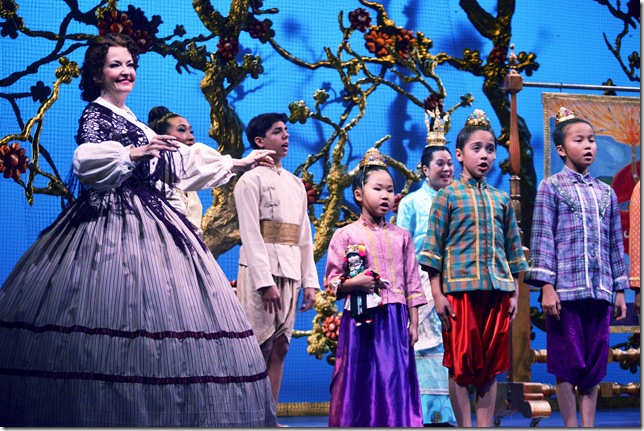 Michele Ragusa (left) leads her pupils in song in The King and I. To her right are Mattine Jensen, Sophia Liano and Elizabeth Michels. (Photo by Janie Willison) 