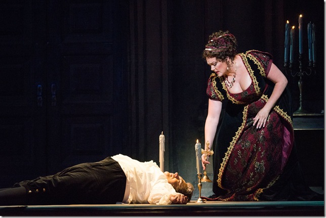 Kara Shay Thomson (right), as Tosca, leaves the body of Scarpia (Todd Thomas) in Act II of Tosca. (Photo by Justin Namon)