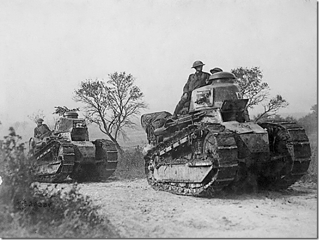 U.S. soldiers drive French-made tanks in the Argonne Forest in 1918.