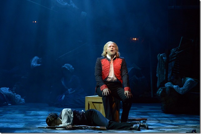Valjean (Gregg Goodbrod) sings as Marius (Joshua Charles Skurnik) sleeps in the Maltz Jupiter Theatre’s production of “Les Misérables.” (Photo by Alicia Donelan)