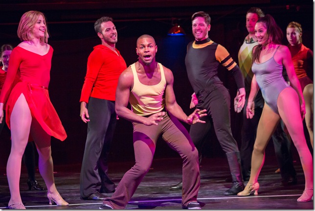 Michael Wallace (center) and the cast of “A Chorus Line,” at Broward Stage Door Theater. (Photo by George Wentzler)