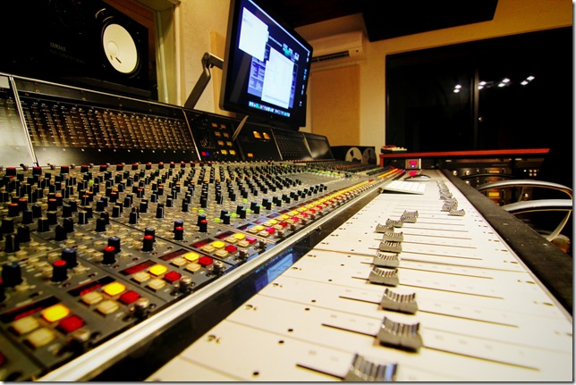A closeup of a mixing desk at Liberated Studios.